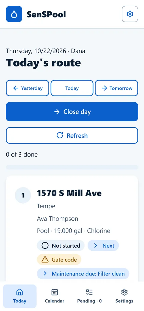 Technician's phone showing today's route with the first stop, gate code and dog warning